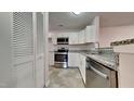 Well-appointed kitchen features sleek stainless steel appliances, granite countertops, and ample storage for culinary enthusiasts at 4911 Hollenden Dr, Raleigh, NC 27616
