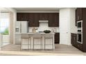 Modern kitchen boasts dark cabinets, a center island with seating, stainless steel appliances, and stylish countertops at 632 Emerald Bay Cir, Raleigh, NC 27610