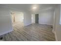 Bright living room showcasing new flooring, fresh paint, and an open floor plan at 905 Spruce Pine Trl, Durham, NC 27705