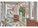 Inviting front porch with comfortable seating and charming exterior details at 102 Westside Dr, Chapel Hill, NC 27516