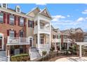 Inviting townhome community with a multi-level balcony and landscaped yard at 10321 Sablewood Dr # 108, Raleigh, NC 27617