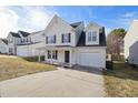 Charming two-story home with a covered front porch and attached garage at 1420 Springshire Ct, Raleigh, NC 27610