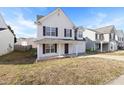 Charming two-story home with a covered front porch and attached garage at 1420 Springshire Ct, Raleigh, NC 27610