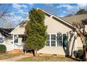 Charming home with classic curb appeal and tidy front lawn at 1614 W Cotton Gin Dr, Clayton, NC 27527