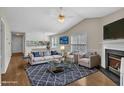 Spacious living room featuring a fireplace, hardwood floors, and open-concept design at 1614 W Cotton Gin Dr, Clayton, NC 27527