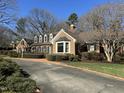 Well-maintained brick home featuring a bay window and brick-lined driveway at 30 Brookside Place, Durham, NC 27705