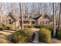 Lovely brick home with well-manicured landscaping and a welcoming walkway at 3120 Timberlyne Dr, Mebane, NC 27302