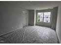Bright, unfinished bedroom with a large window for natural light and a neutral color palette at 332 Chesapeak Commons St # 141, Garner, NC 27529