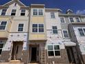 New townhome facade is under construction and ready for a homeowner at 332 Chesapeak Commons St # 141, Garner, NC 27529