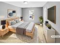 Cozy bedroom with a soft color palette, wooden furniture, and a window for natural light at 405 Ganyard Farm Way, Durham, NC 27703