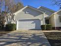 This home features a wide driveway and an attached two-car garage, perfect for parking and storage at 4300 Mantua Way, Raleigh, NC 27604