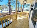 An inviting porch featuring a modern light fixture and fresh wood at 606 E Pearsall St, Dunn, NC 28334