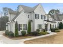 Stunning two-story home featuring painted brick, manicured landscaping, and a welcoming walkway at 1301 Mackinaw Dr, Wake Forest, NC 27587