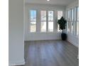 Bright sunroom featuring hardwood floors and an abundance of natural light through large windows at 138 Oban Dr, Homesite 134, Sanford, NC 27330