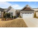 Charming single-story home boasts an attached two-car garage and well-maintained landscaping at 1435 Monterey Bay Dr, Wake Forest, NC 27587