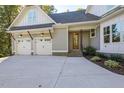 Stylish home featuring a two-car garage and a welcoming front porch at 25 Blackhorn Ct, Pittsboro, NC 27312