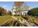 View of the front lawn and the walkway to the front door of this charming home at 3648 Praed Pl, Fuquay Varina, NC 27526