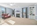 Comfortable living room with fireplace, carpet flooring, and natural light at 3648 Praed Pl, Fuquay Varina, NC 27526