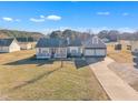 Aerial view of a charming single-story home with a detached two-car garage at 43 Old Halifax Rd, Louisburg, NC 27549