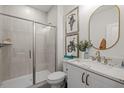 Modern bathroom with a glass-enclosed shower and a marble countertop vanity at 4506 Mint Leaf Ln, Raleigh, NC 27612