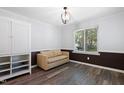 Neutral living space features wood floors, a tan sofa, and plenty of natural light at 5840 Branchwood Rd, Raleigh, NC 27609