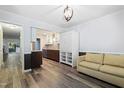 Stylish space with wood floors, comfortable seating, and an open concept to the kitchen at 5840 Branchwood Rd, Raleigh, NC 27609