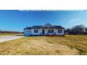 Charming single story home with white siding, black shutters, and a well-manicured lawn at 82 Asher Pointe Way, Benson, NC 27504