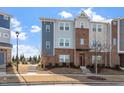 Charming townhome with a mix of brick and siding exterior, plus landscaped front yard at 1018 Salt Glaze Ln, Cary, NC 27519