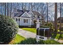 Beautifully landscaped yard and driveway with mailbox next to a well-maintained home at 1137 Chilmark Ave, Wake Forest, NC 27587