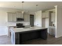 Spacious kitchen with stainless steel appliances and a large center island at 143 Prency Ln, Middlesex, NC 27557