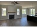 Bright living room with fireplace, hardwood floors, and natural light at 143 Prency Ln, Middlesex, NC 27557
