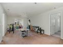 A living room with neutral walls, carpet and a ceiling fan at 2020 University Woods Rd # 203, Raleigh, NC 27603