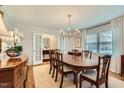 Formal dining room with hardwood floors and large window at 212 Sampson St, Raleigh, NC 27609