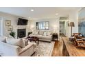 Cozy living room with a fireplace, and hardwood floors at 212 Sampson St, Raleigh, NC 27609