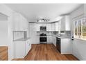Renovated kitchen boasts stainless steel appliances, granite countertops, and ample natural light at 2611 Atlantic St, Durham, NC 27707