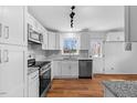 Newly remodeled kitchen with stainless steel appliances and sleek granite countertops at 2611 Atlantic St, Durham, NC 27707