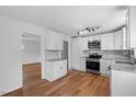 Bright kitchen features stainless steel appliances, granite countertops, and hardwood flooring at 2611 Atlantic St, Durham, NC 27707
