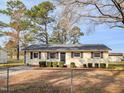 Charming single-story home with mature trees and a well-maintained front yard at 2918 Avalon Rd, Rocky Mount, NC 27801