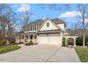 Charming two-story home featuring a welcoming front porch and a two-car garage at 302 Edinburgh Dr, Cary, NC 27511