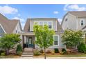 Charming two-story home features an inviting front porch and well maintained landscaping at 5520 Advancing Ave, Raleigh, NC 27616