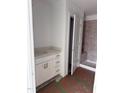 Bright bathroom with a stylish vanity, tiled shower, and contemporary design at 64 Shay St, Angier, NC 27501