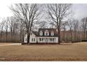 Traditional-style home with a covered porch and a spacious front yard at 730 Duck Pond Rd, Nashville, NC 27856