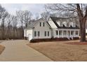 A spacious home with an attached garage and a welcoming front porch at 730 Duck Pond Rd, Nashville, NC 27856