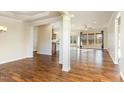 Bright, open-concept living space with hardwood floors and a large window array at 1100 Gaston Manor Dr, Durham, NC 27703
