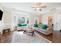 Bright living room with large windows, hardwood floors, and neutral decor at 214 Woodcrest Ave, Smithfield, NC 27577