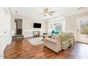 Inviting living room with hardwood floors, natural light, and a view to the deck at 214 Woodcrest Ave, Smithfield, NC 27577