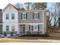 Inviting two-story home with a landscaped front yard, and covered entryway at 2440 Tonoloway Dr, Raleigh, NC 27610