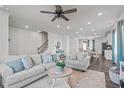 Spacious living room with wood floors, modern decor, and ample seating at 2440 Tonoloway Dr, Raleigh, NC 27610