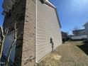 This home features both brick and vinyl siding, along with an easily maintainable lawn at 264 Steel Hopper Way, Garner, NC 27529