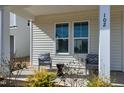 Inviting front porch with seating area, perfect for enjoying the outdoors at 3010 Garner Rd # 102, Raleigh, NC 27610